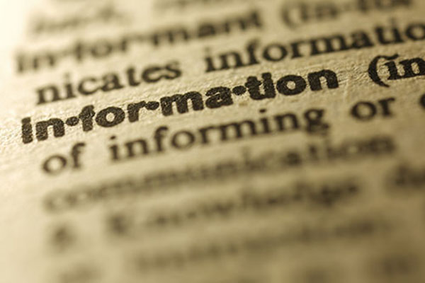 Close up of dictionary page focusing on the word 'information'